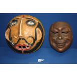 A vintage papier mache Mask, 26 cms with Dali style moustache and a carved wood Oriental Mask,