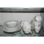 A quantity of Susie Cooper dinner and tea ware including teacups and saucers, side plates,