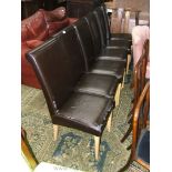 A set of six leather upholstered Dining Chairs