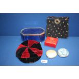 A glass jewellery box, an embroidered evening bag,