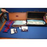 A metal cased craft Sash and Apron together with a leather Masons Case with Arch Master Mason and