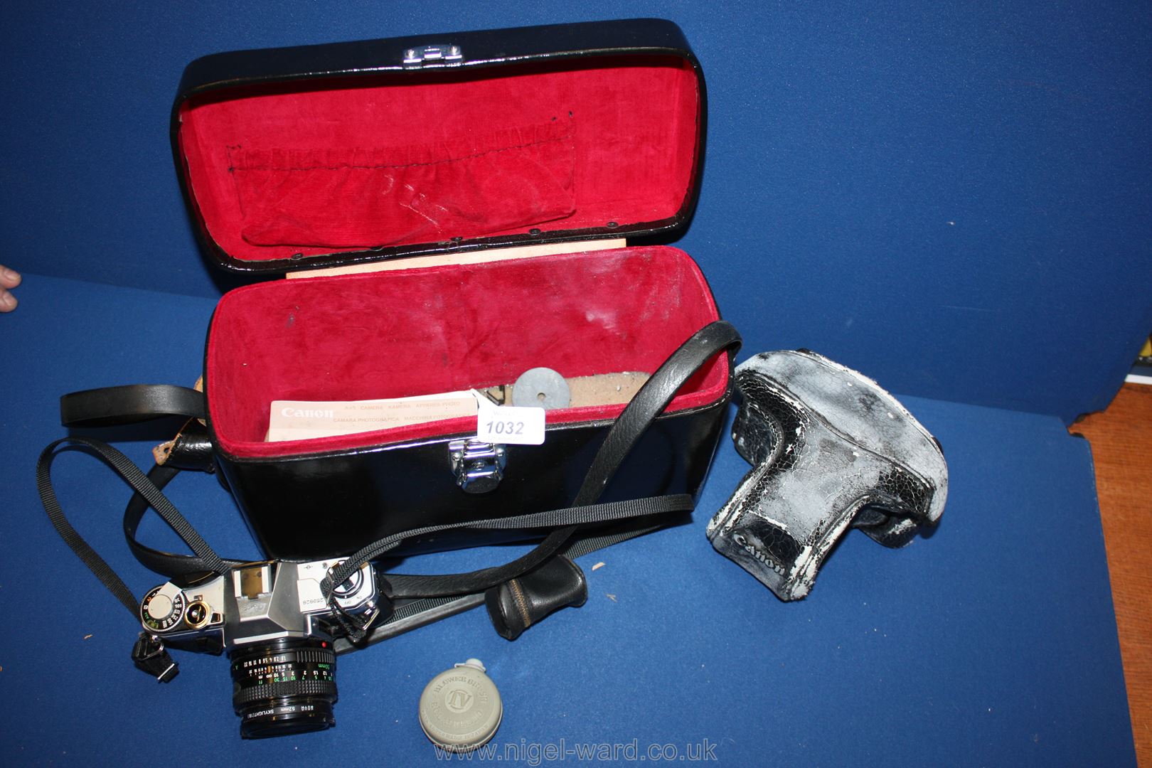 A Canon AT-1 35mm SLR Camera with a Canon 50mm f/1.8 FD lens outfit case, etc.