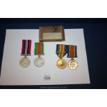 A pair of WWI Medals in the name of Lieutenant W. S. Burrell and two WWII Medals.