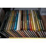 A box of home repair and improvement books incl patios and gardening, floor sanding,