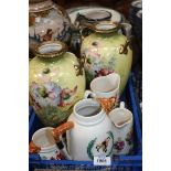 Four china Jugs including Hunting scenes and a pair of yellow ground German Vases with floral