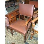 An Oak baronial style Elbow Chair with pad back, nailed brown leather upholstery,