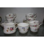 A Minton Teaset in 'Marlow' pattern comprising milk jug, sugar basin, cups and saucers, etc.