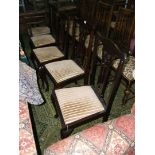 A set of four Edwardian Mahogany Dining Chairs, fret-cut, pierced splats,