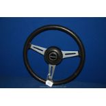 An Original Factory Fitted Steering Wheel from a 1975 Triumph Spitfire with Central Lucas 'Triumph'