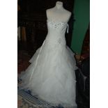 A strapless Wedding Dress with beaded bodice and tiered chiffon skirt, about size 10,