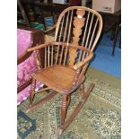 An Ash period Rocking Chair, having bent Ash hoop back and arm rail, fret-cut splat, solid Ash seat,