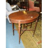 An Edwardian Mahogany oval Occasional Table with strung top,