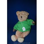 A faded pink, straw filled soft jointed Teddy Bear, replaced paw pads,