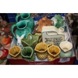 Five Sylvac Jugs, a pair of green vine and leaf Jugs, Cottage ware butter dish, etc.