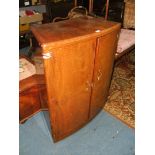 A Deco style Walnut Cocktail Cabinet with twin fold over top opening to reveal glass pane,