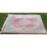 A Pink Ground Chinese Cut Rug Superbly Decorated with Flowers - 9' x 5'9".