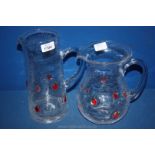 Two modern bubble glass Water Jugs with strawberry decoration