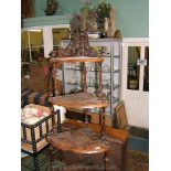 A Victorian Walnut inlaid four tier Corner Wotnot with slender turned and fluted column supports