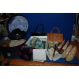 A basket of vintage shoes and bags,