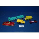 Five Lesney model vehicles.