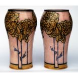 A pair of Royal Doulton Art Deco style stoneware Vases with chrysanthemum pattern by Bessie Newbery,