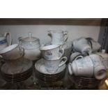 A Noritake 'Carolyn' pattern Teaset for twelve comprising cups and saucers, tea plates, milk jug,