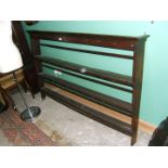 A period Oak three shelf Plate Rack with iron hooks and rear braces,