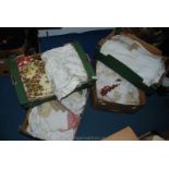 Four boxes of linen and lace doilies,
