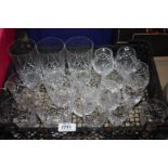 A quantity of cut glass drinking glasses including tumblers, whiskey, lemonade,