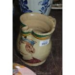 A hand made pottery Jug possibly an Ale Jug with a gentleman's Portrait as decoration