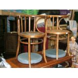 A pair of bentwood circular seat, cafe Elbow Chairs.