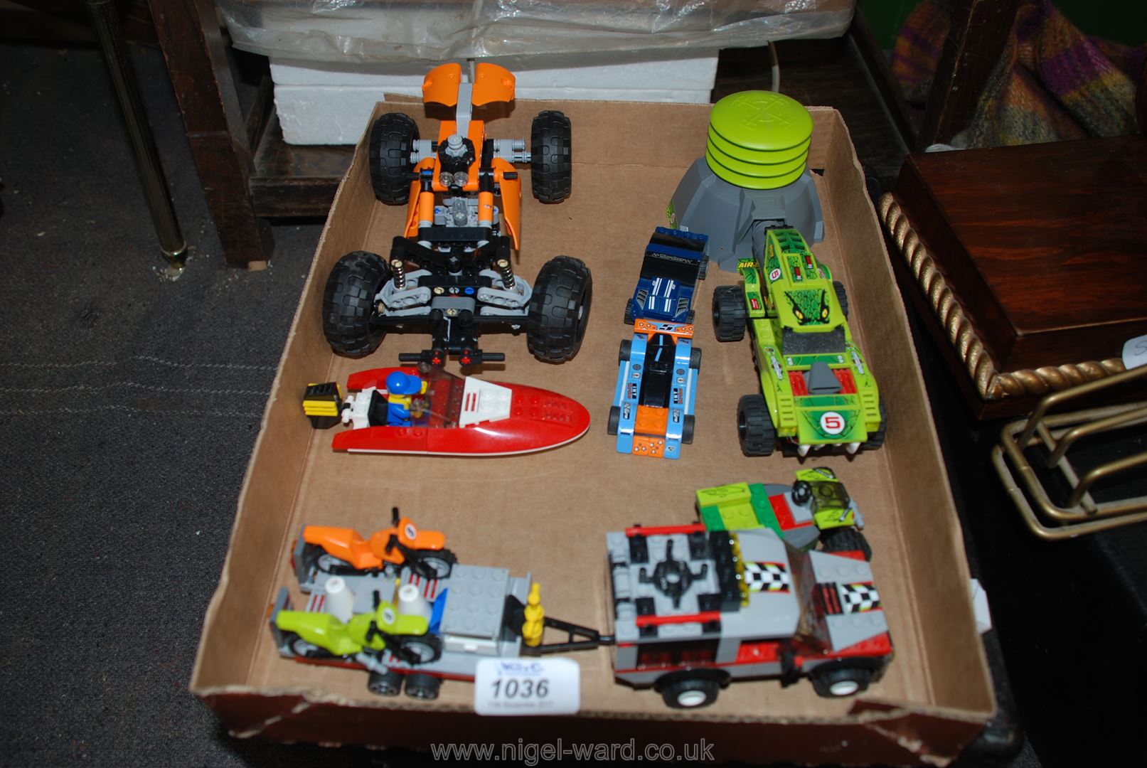 A retired assembled Lego Racing themed Models including a Technic Quad Bike, a Speedboat,