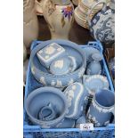 A quantity of blue Wedgwood Jasperware including Vases, Jugs, Lighters, Bowls, etc.