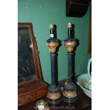 A pair of black and gilt Table Lamps with circular bases having gold coloured bands,