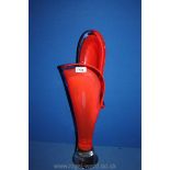 A 1960/70's Murano heavy glass sculptured Vase in red tones cased in clear glass with a heavy clear