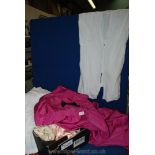 A box of children's and adult's vintage clothes