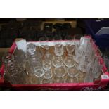 A quantity of cut crystal glasses including sherry, small brandy baloons, two decanters,