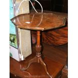 A reproduction Walnut Wine Table with stylised octagonal top having burr inlay,