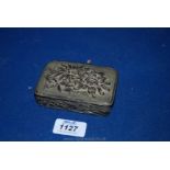 A small metal Box heavily embossed to the sides with seascapes of birds, waves and aquatic animals,