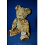 A jointed Teddy Bear bell within, sewn nose and mouth and velvet paw pads, 17" long,