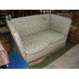 An elegant Knoll two seater Sofa with high back and arms in cream ground,