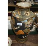A tall six-sided Japanese Vase with figures and dragons decoration and gold coloured bands,