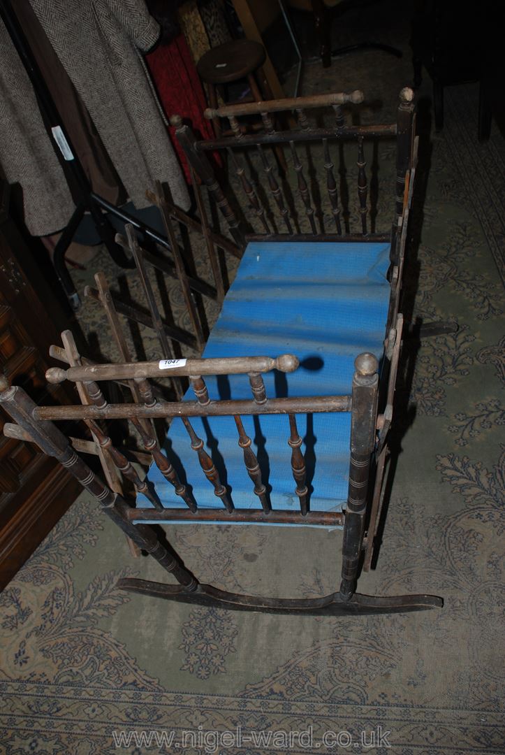 An antique expanding Baby Rocking Cradle