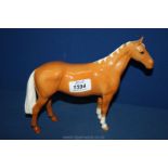 A Beswick Palomino Horse, standing with two white front socks,