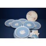 Eleven blue Wedgwood Jasperware Christmas Plates and a Royal Doulton 'Occasions' display plate
