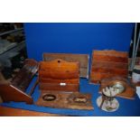 A quantity of treen to include letter racks, pipe racks, carved bookshelves, clock,