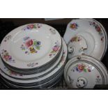 A Newport Pottery part Dinner Service with floral decoration including various size plates,