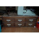 A set of six Counter top Oak Drawers with original fittings.
