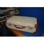 A large canvas and leather Suitcase