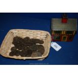 A tin plate Money box in the form of a house together with a quantity of Victorian pennies (approx